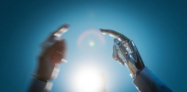 istock Businessman finger touching robot finger 1160332476