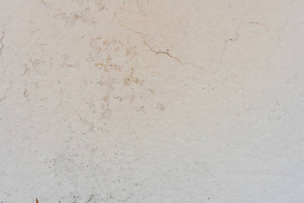 istock Texture of a concrete wall with cracks and scratches which can be used as a background 1160332903