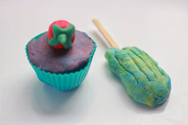 istock colorful play dough on white background, food, cale, ice cream 1160333857