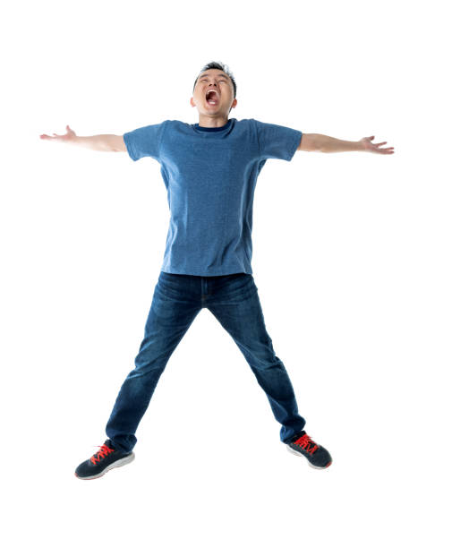 istock Excited man jumping on white background 1160335112