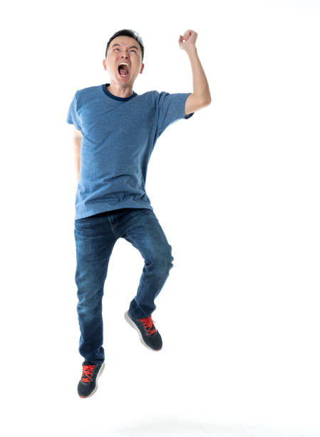 istock Excited man jumping on white background 1160335641