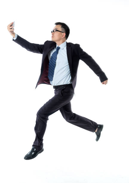 istock Businessman taking a selfie on white background 1160336079