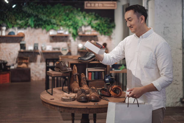 istock Consumer services at boutique shoe stores 1160346185