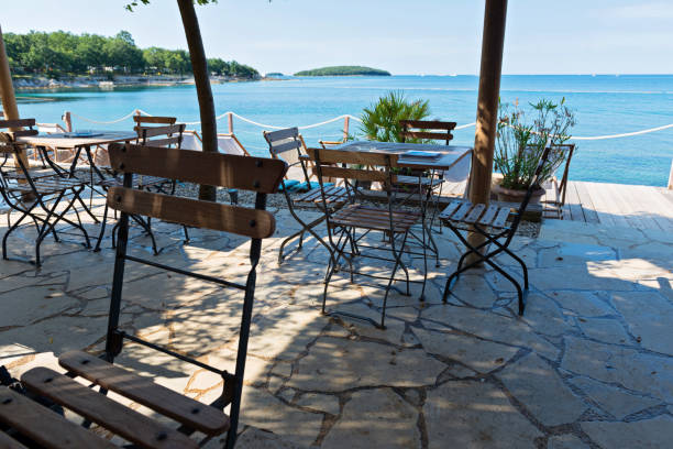 istock Chairs and tables with beautiful sea view 1160348857