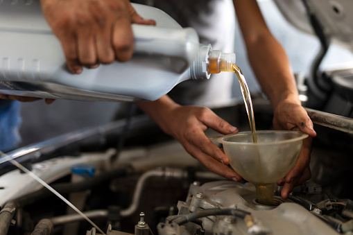 Car Motor Oil is Changed by repairman