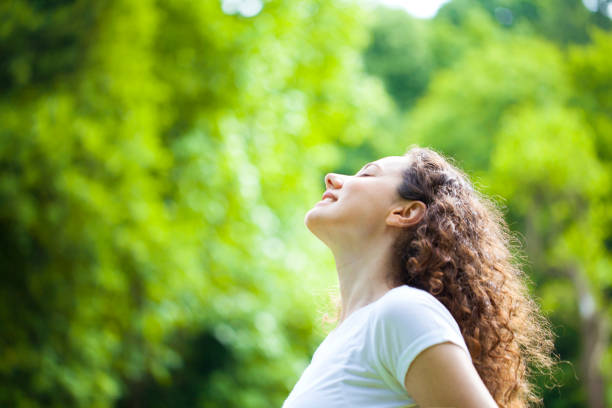 istock Serene Woman Relaxing At The Park 1160354951