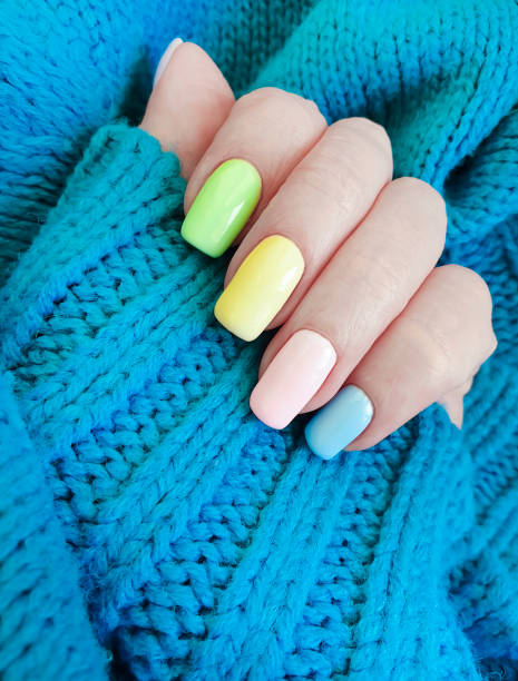 istock female hand beautiful manicure sweater 1160355155