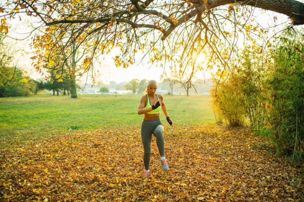 istock Blonde running in the park 1160356582