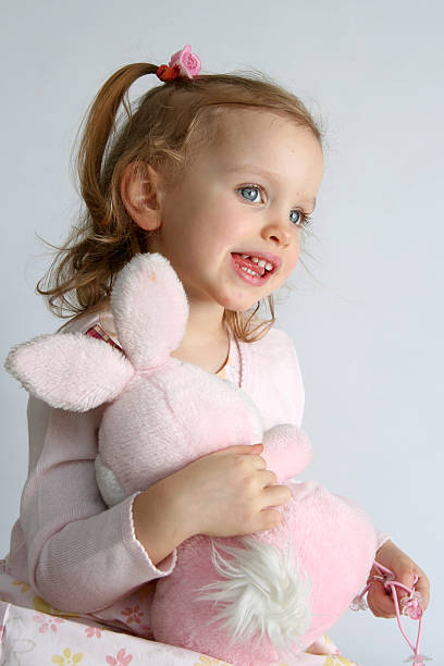 istock Baby girl and pink bunny 116035964