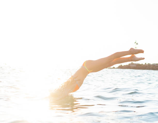 istock Girl diving into water 1160362251