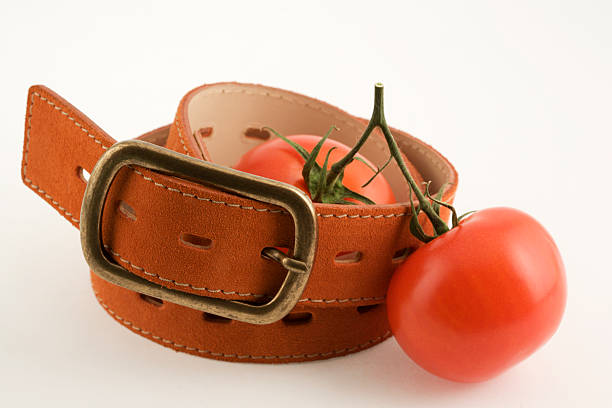 Tomatoes and the belt stock photo