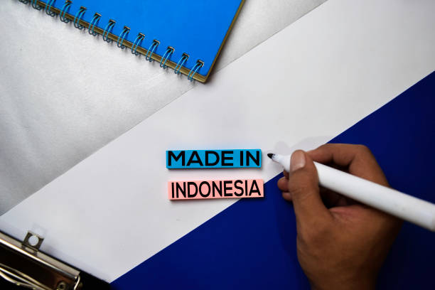 istock Made In Indonesia text on sticky notes with color office desk concept 1160364121