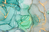 Abstract colorful background, wallpaper. Mixing acrylic paints. Modern art. Marble texture. Alcohol ink colors  translucent
