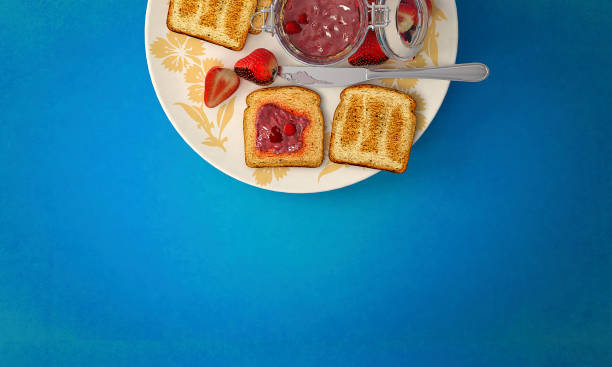 istock Healthy fresh fruits, jam and toast bread on blue background 1160364549