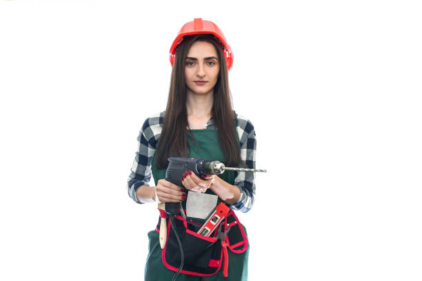 istock Woman in tool belt and coverall isolated on white 1160365221
