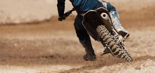 istock Motocross racer accelerating speed in track 1160366039