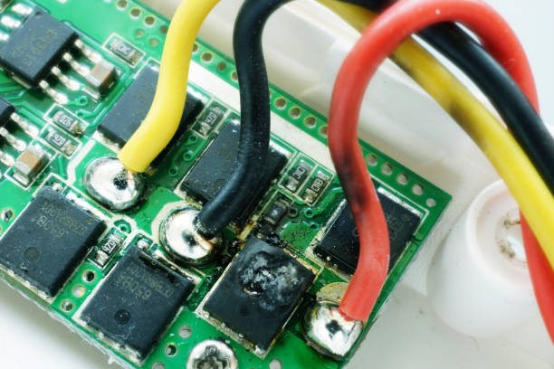 istock Microcircuit with a burnt-out microchip. Breakdown of electronic equipment. 1160366936