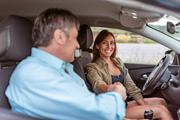 istock Friends hand shaking at the car 1160367262
