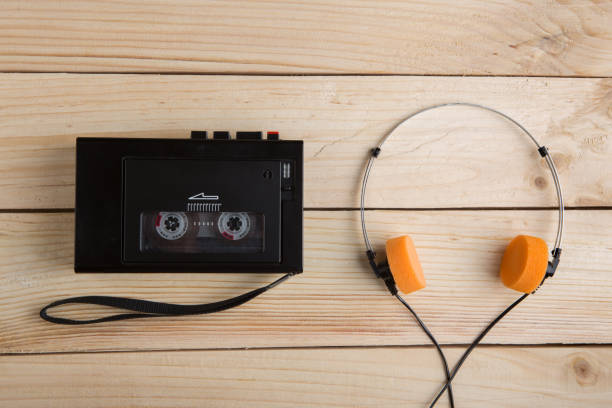 istock Old portable cassette player on a wooden background 1160367344