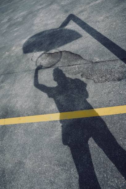 istock man shadow silhouette playing basketball 1160368227