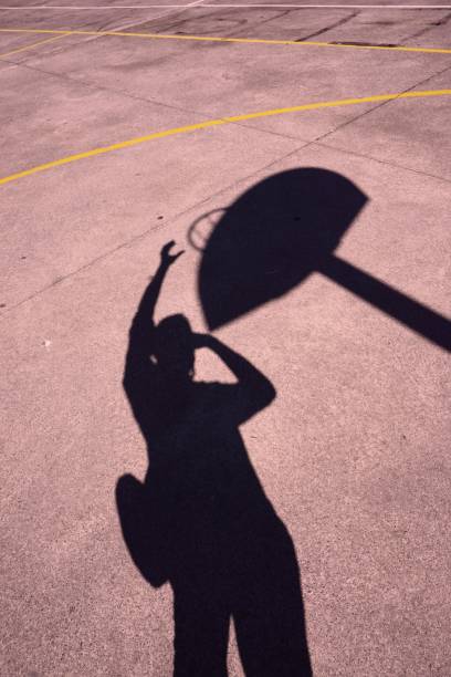 istock man shadow silhouette playing basketball 1160368246