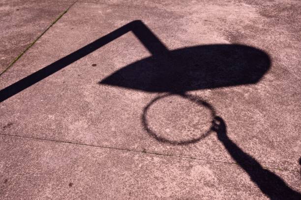 istock man shadow silhouette playing basketball 1160368247