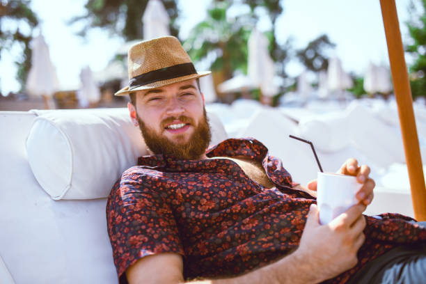 Smiling Male And His Favorite Beach Ice Coffee