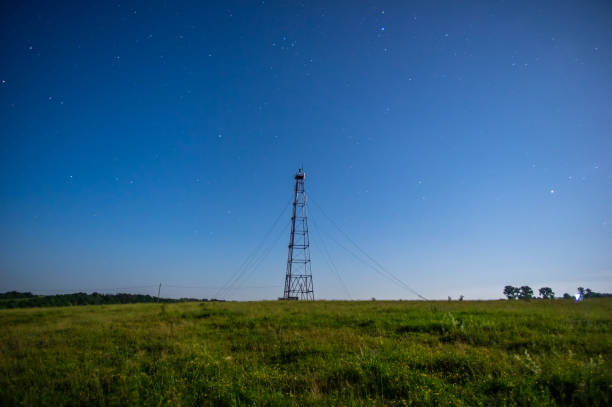 istock Telecommunication tower against the starry sky in the field 1160371433