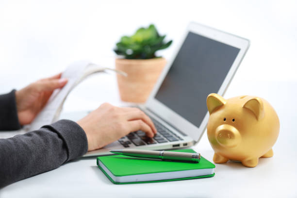 istock Woman using laptop paying bills online 1160371793