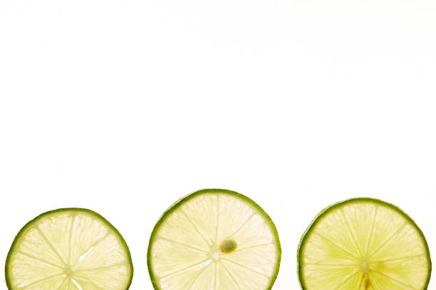 istock slice of fresh lime on white background 1160371922