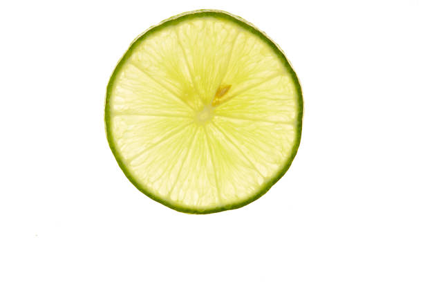 istock slice of fresh lime on white background 1160372452