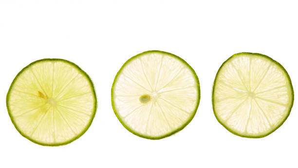 istock slice of fresh lime on white background 1160372456