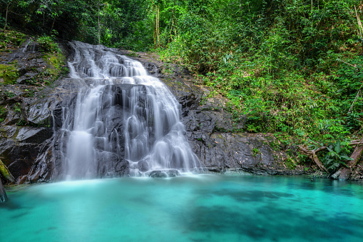 beautiful mountain waterfall in Thailand. Tropics, bright saturated colors.