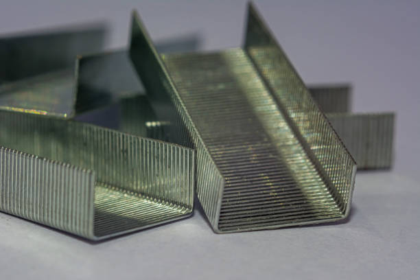 istock Stack of metal staples isolated from white background 1160377398