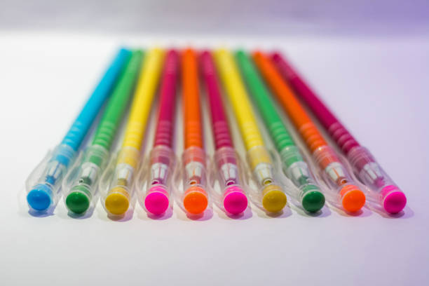 Set of colored pens on white background
