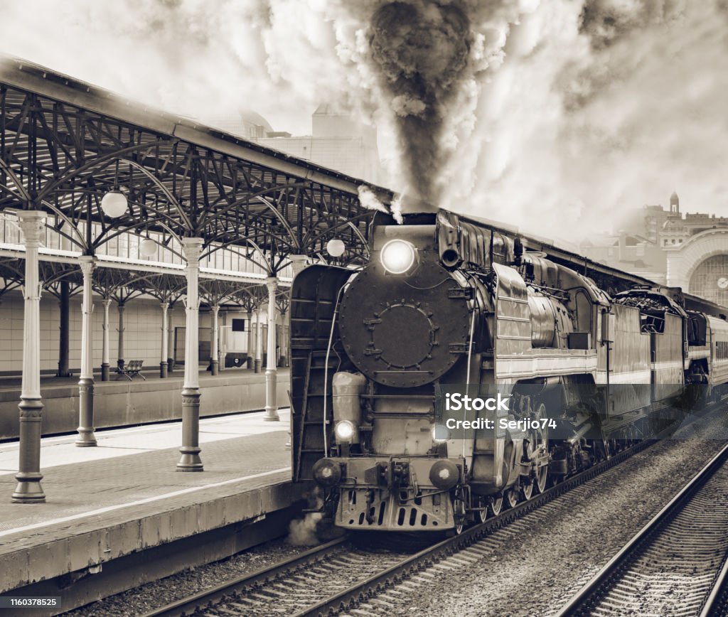 Retro train departs from railway station building. Retro train departs from railway station building. Moscow. Train - Vehicle Stock Photo