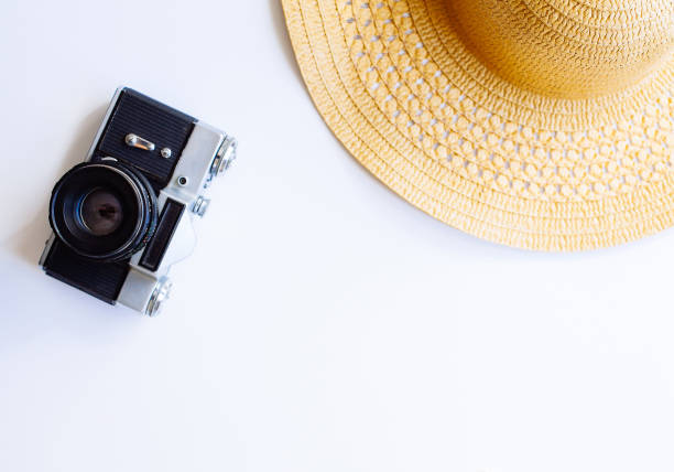 istock Flat lay design of travel concept with camera, hat, shells 1160379853