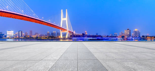 istock Shanghai Nanpu bridge and empty square floor scenery at night 1160382945