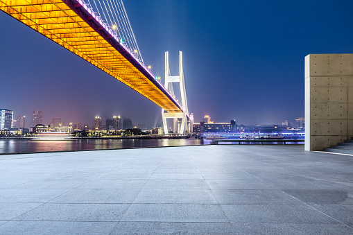 Shanghai Nanpu bridge and empty square floor scenery at night,China