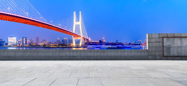 istock Shanghai Nanpu bridge and empty square floor scenery at night 1160383583
