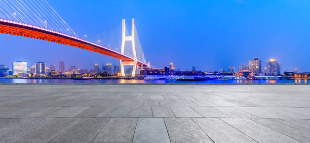 istock Shanghai Nanpu bridge and empty square floor scenery at night 1160384142