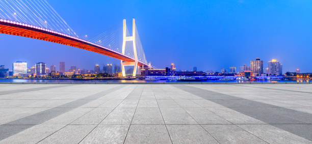 istock Shanghai Nanpu bridge and empty square floor scenery at night 1160384183