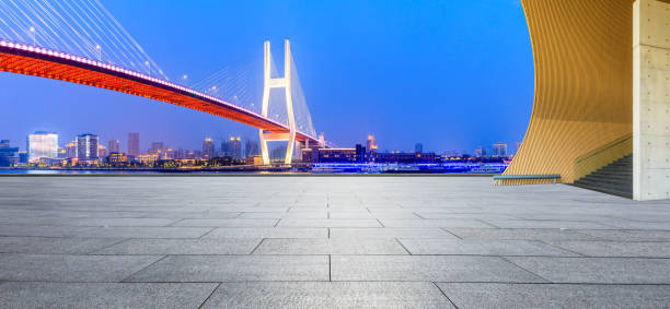 istock Shanghai Nanpu bridge and empty square floor scenery at night 1160384377