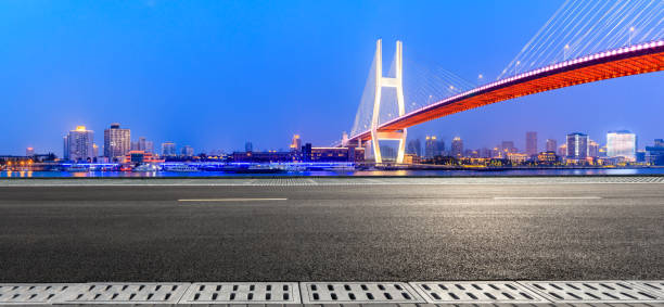 istock Shanghai Nanpu bridge and asphalt road scenery at night 1160384409