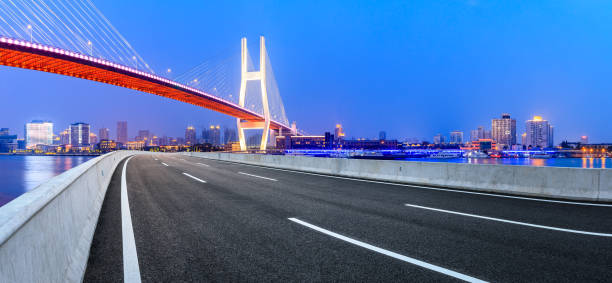 istock Shanghai Nanpu bridge and asphalt road scenery at night 1160384563