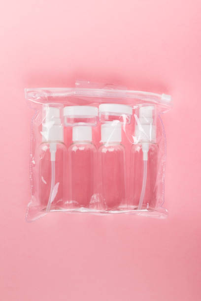 istock Travel small bottle set on a pink background. Top view 1160384636
