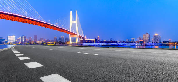 istock Shanghai Nanpu bridge and asphalt road scenery at night 1160384692