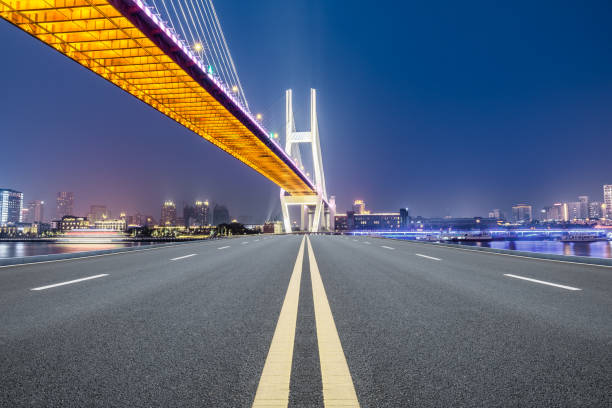 istock Shanghai Nanpu bridge and asphalt road scenery at night 1160384694