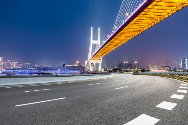 istock Shanghai Nanpu bridge and asphalt road scenery at night 1160384798
