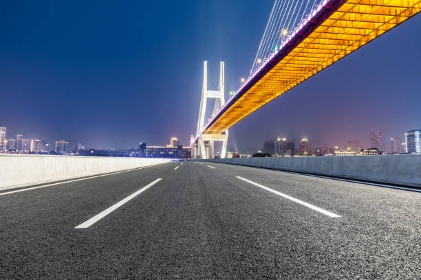 istock Shanghai Nanpu bridge and asphalt road scenery at night 1160384864